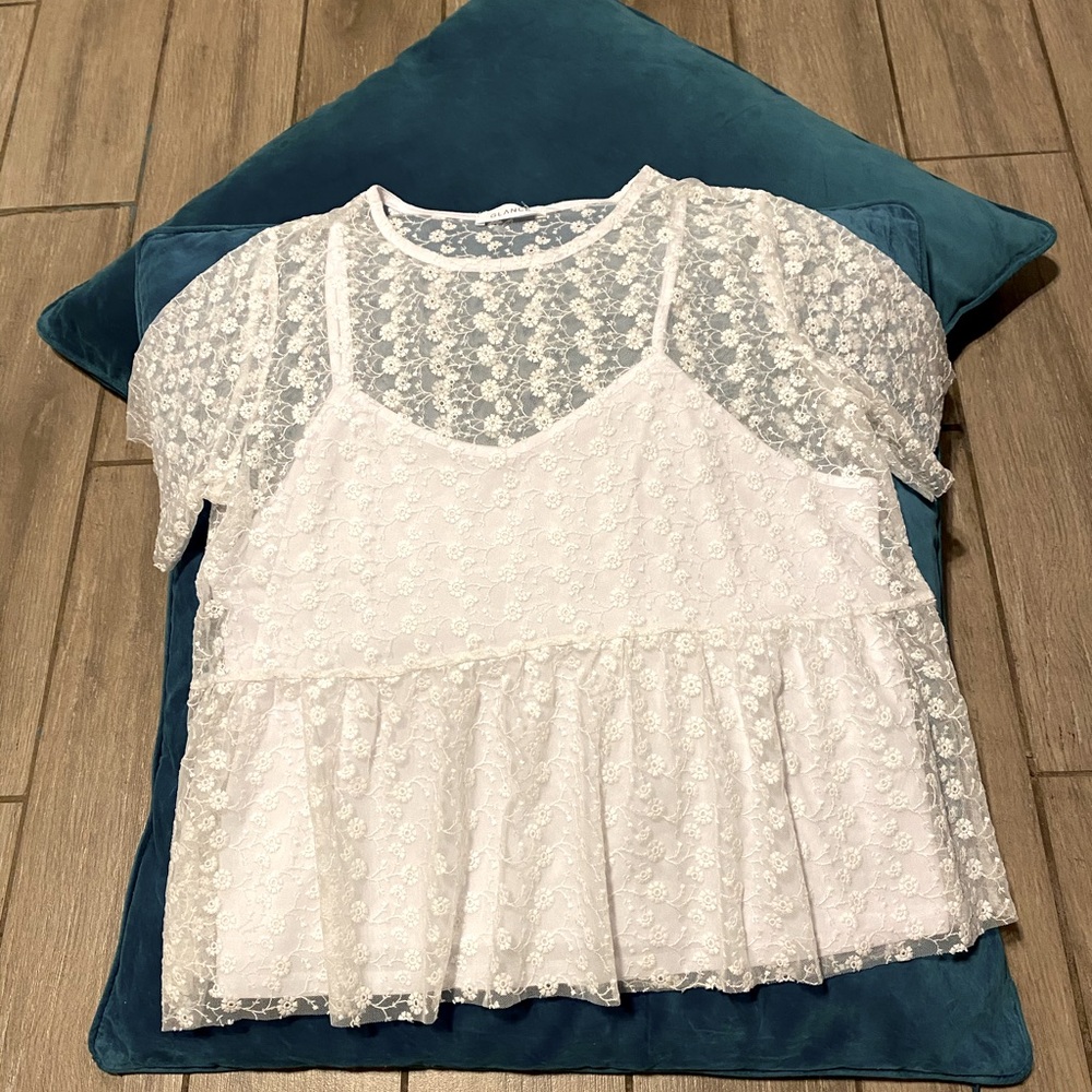 strappy blouse with attached flower embroidered.